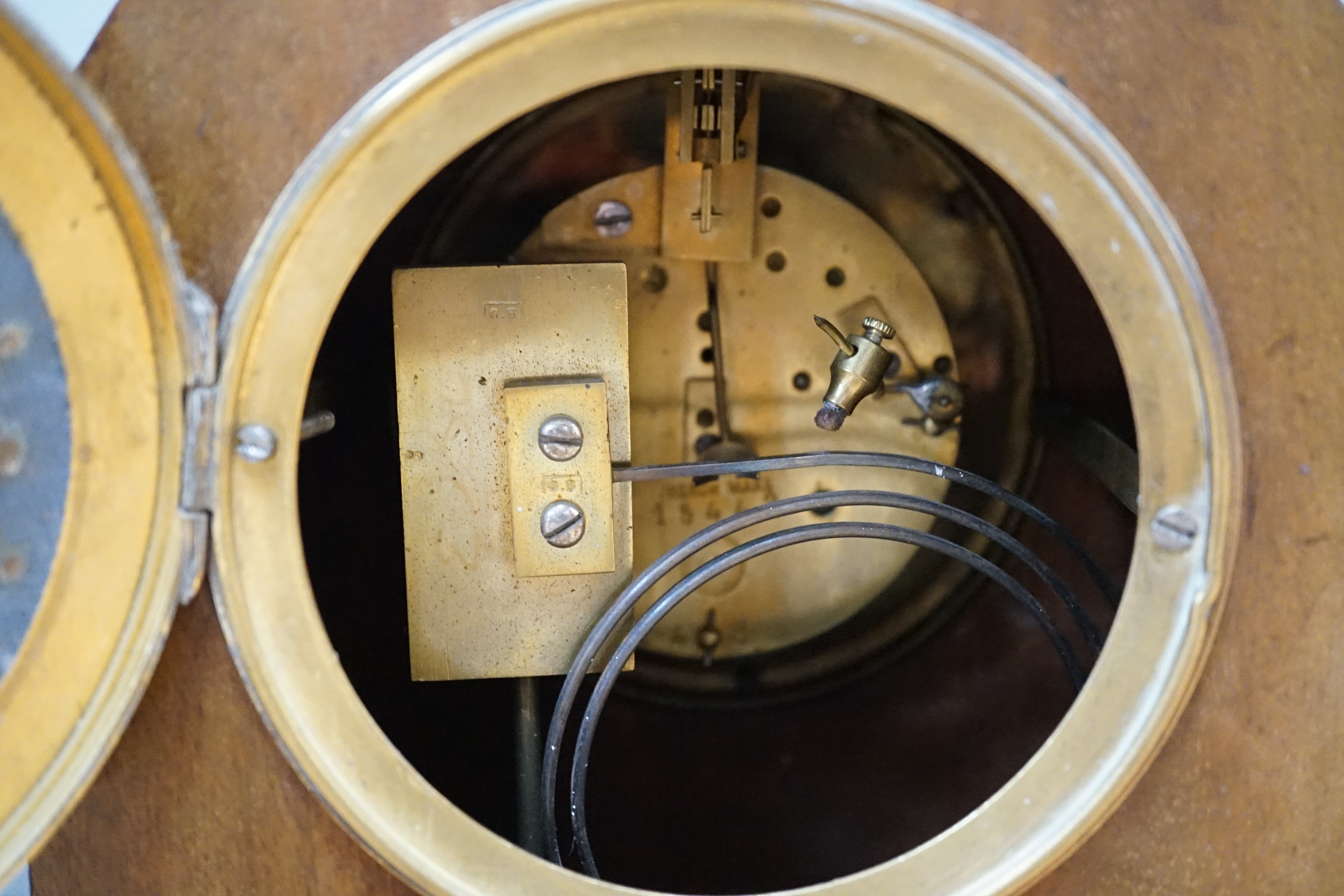 Two early 20th century mantel clocks; a mahogany timepiece and an inlaid Edwardian clock with engine turned face, striking on a coiled gong, tallest 35cm